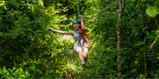 Girl Ziplining at Cape Tribulation. Port Douglas Tour. Family Price. Daintree Rainforest.