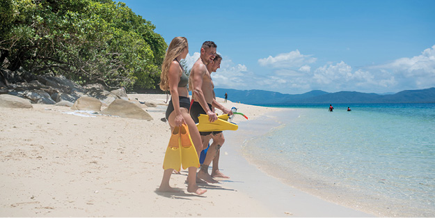 Snorkellers at Nudey Beach in Fitzroy. Cairns Tours. Visit Fitzroy Island. Great Barrier Reef.